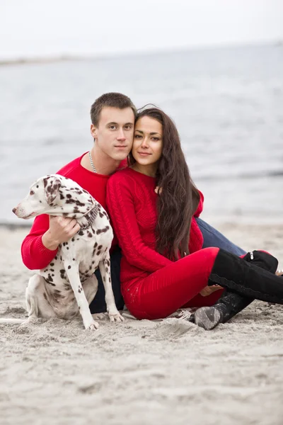Romantic couple with a dog — Stock Photo, Image