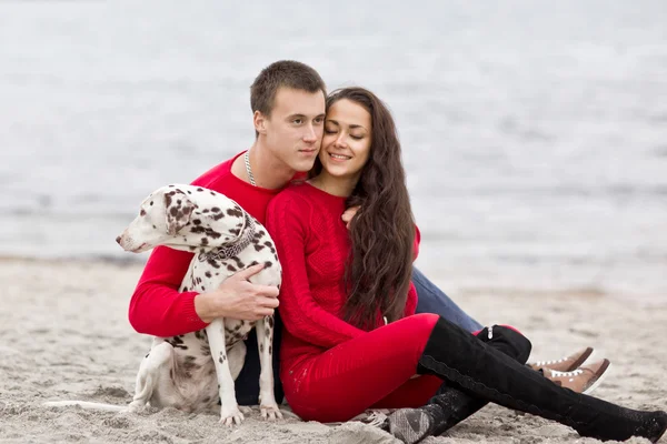 Romantic couple with a dog — Stock Photo, Image