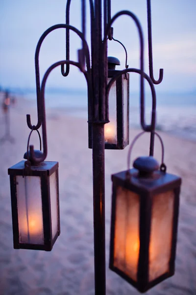 Lantern on the beach in sunset — Stock Photo, Image