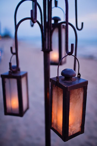 Lantern on the beach in sunset — Stock Photo, Image