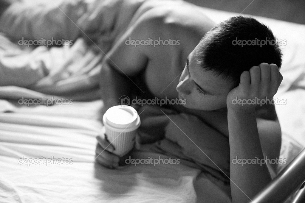 Man in bed with coffee
