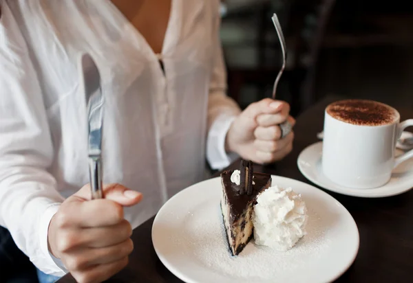 Woman eating a piece of cake — Stock Photo, Image