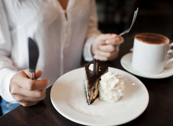 Woman eating a piece of cake — Stock Photo, Image