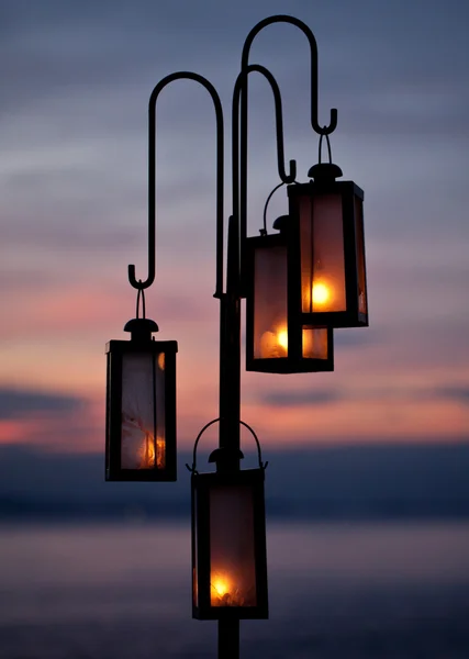 Lantern on the beach in sunset — Stock Photo, Image