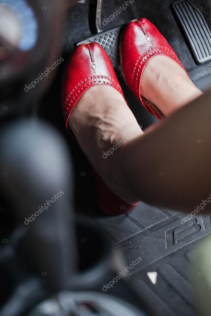 A woman's foot depressing the brake pedal of a car. Stock Photo by ...