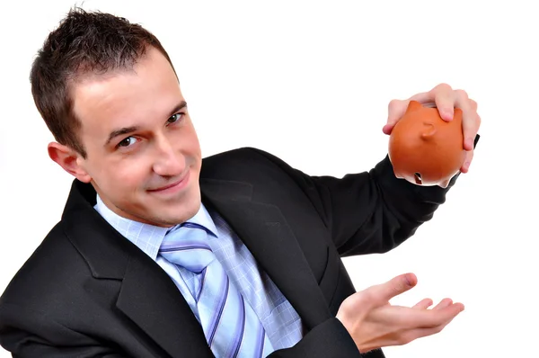 Zakenman staren naar een piggy bank geïsoleerd — Stockfoto