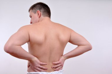 young caucasian man with pain in a back isolated on white clipart