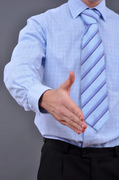 Un hombre de negocios con la mano abierta listo para cerrar un trato —  Fotos de Stock