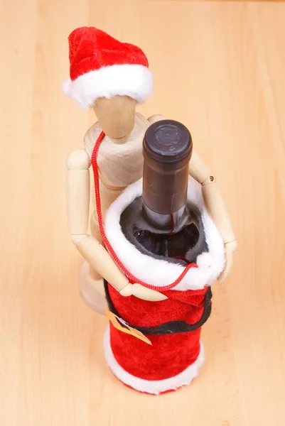 Bottle and wood man isolated on white — Stock Photo, Image