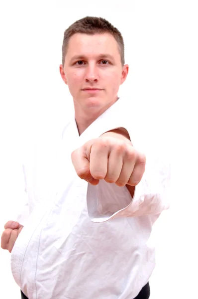 Karate vechten houding op een witte achterzijde — Stockfoto