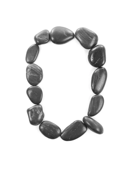 Letra 'Q' hecha de piedras aisladas en blanco — Foto de Stock