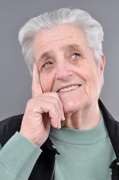 Old, attractive Caucasian woman thinking — Stockfoto