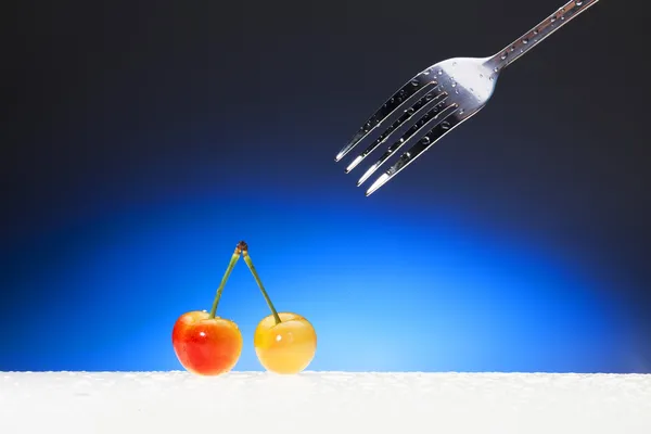 Cherries and fork — Stock Photo, Image