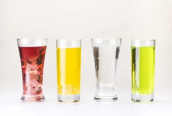 Four glass of drink on white background — Stock Photo, Image