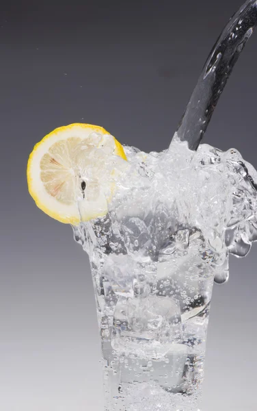 Pouring water into glass — Stock Photo, Image