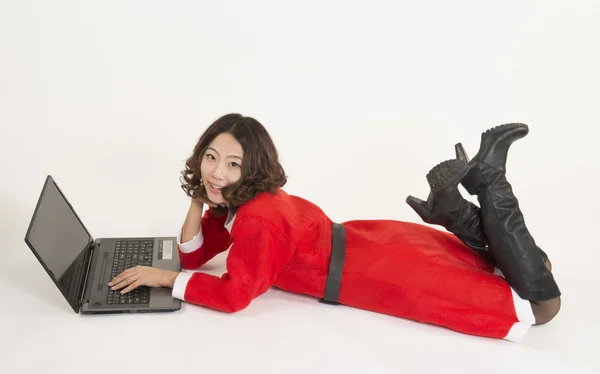 Christmas girl with computer — Stock Photo, Image