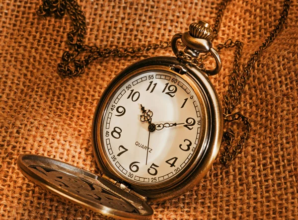 Pocket watch with gunny — Stock Photo, Image