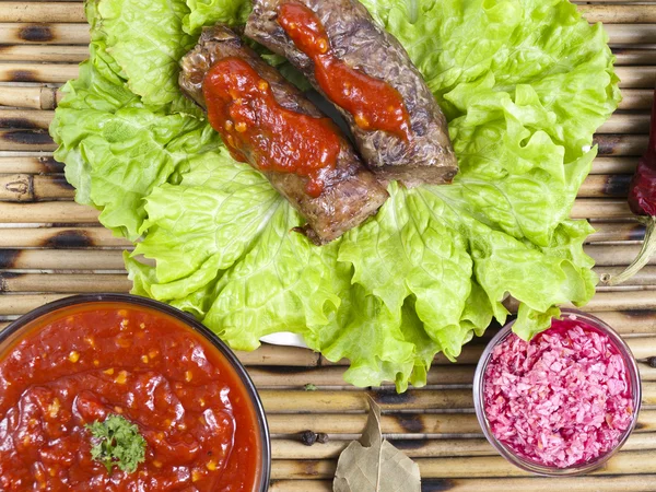 Meat sausage on a table — Stock Photo, Image