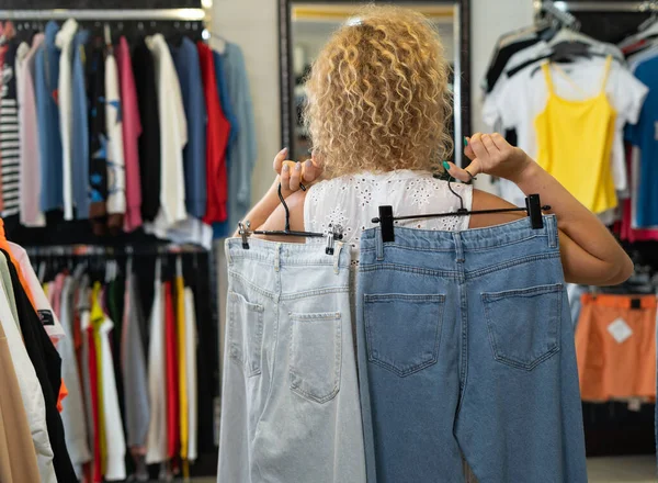 Shopping Clothing Store Girl Choosing Jeans Back View Denim Jeans — Stock Photo, Image
