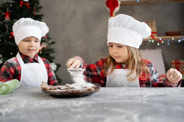 Children Cooking Christmas Gingerbread Brother Sister Decorate Biscuits Powdered Sugar — Stock Photo, Image