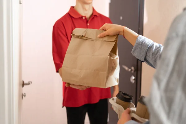 Food Delivery Concept Deliveryman Gives Package Order Client Close Craft — стоковое фото