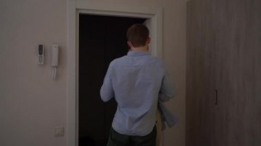 couple in love man and woman in casual clothes kiss passionately at home go to bed.