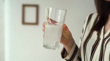 health and vitamins concept, glass of water with effervescent tablet of vitamin complex for pregnant women, healthy lifestyle