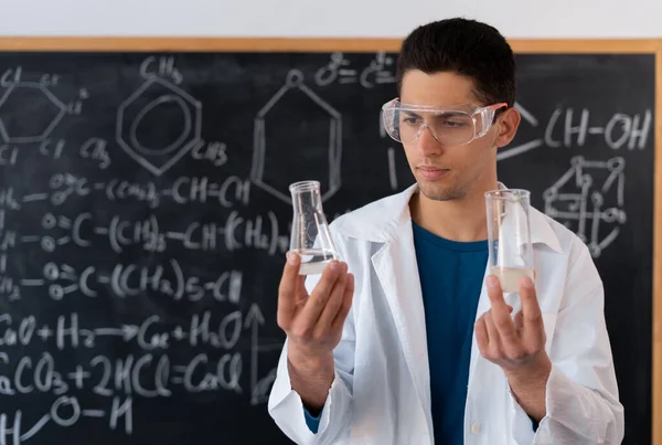 Young Arab Male Chemistry Teacher Stands Background Chalk Board Different — 스톡 사진