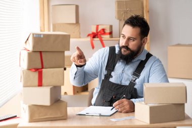 Entrepreneurs Small Business SME Independent Indian men work at home, commercial checking cardboard box, online marketing, packing boxes, SME sellers, online sales, concept e-commerce team