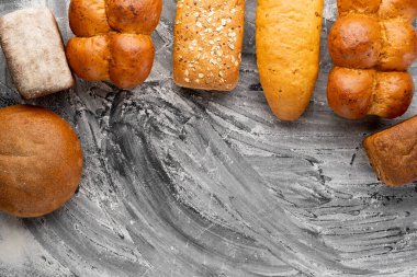 Freshly baked bread on black table top, bakery and healthy food flat lay, place for text