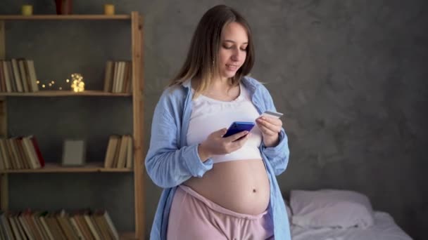 Young Pregnant Woman Shopping Internet Using Banking App Service Smartphone — Stock Video