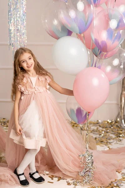 Positive Small Kid Dressed Festive Dress Carries Air Balloons Celebrates — Stock Photo, Image