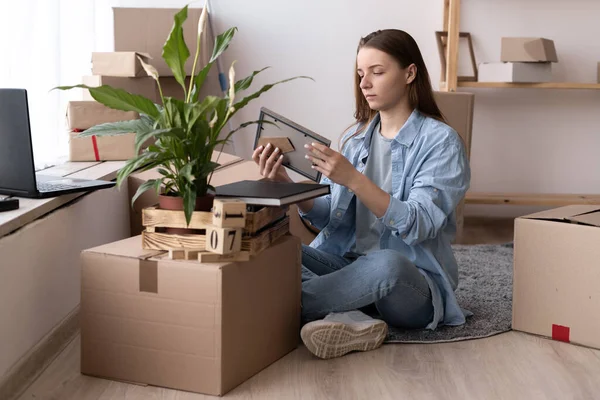 Young Woman Moving New Place Sitting Floor Hugging Holding Frame — 图库照片