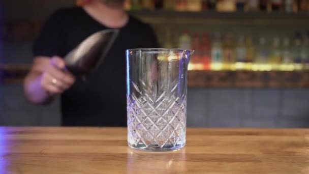Close Male Bartenders Hand Pours Pieces Ice Empty Glass Bar — Video