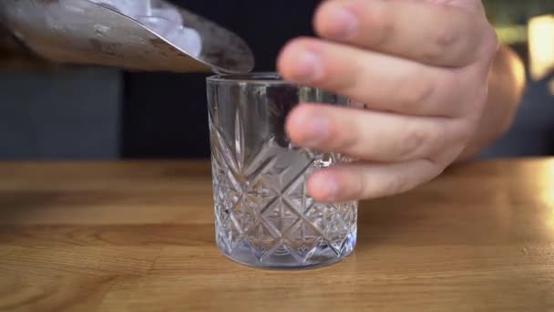 Bartender Face Stirs Ice Cubes Cocktail Glass Spoon Close — Stock video