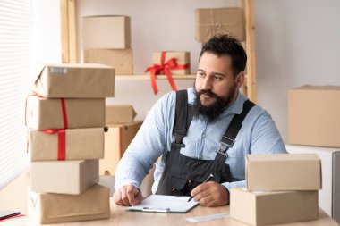 small business start-up, indian entrepreneur SME freelance person working with box, young small business owner office online market package shipping box, SME delivery e-commerce concept