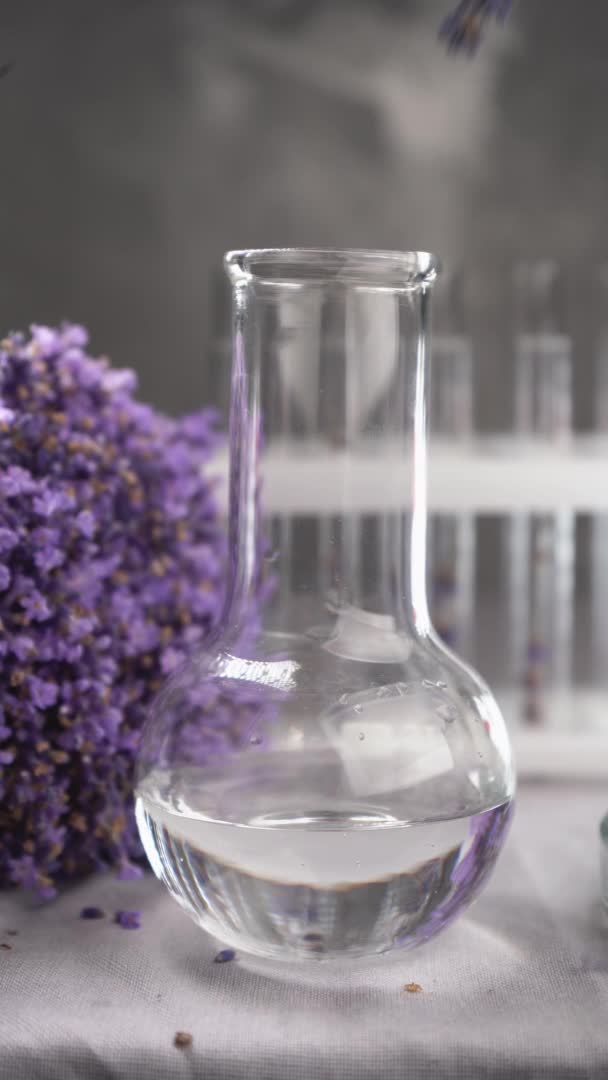 Lavender Herb Flower Water Glass Bottle Flask Flowers White Background — 图库视频影像
