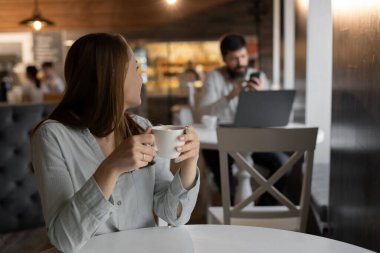 charming girl flirting chatting with young attractive man to cafe table getting acquainted, asking on romantic date, first impression concept