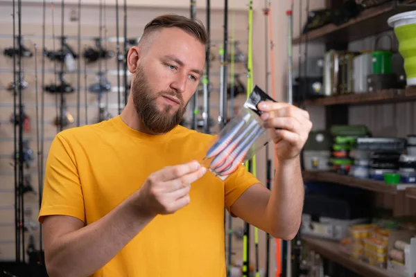 Young Man Choosing Fishing Accessories Sports Shop Tackle Silicone Bait — 스톡 사진