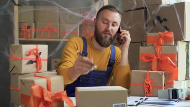 Young Bearded Man Glasses Business Owner Sits Halloween Decorated Home — Vídeo de Stock