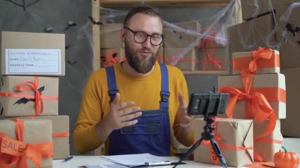 Bearded Man Glasses Business Owner Sits Halloween Decorated Home Office — Vídeo de stock