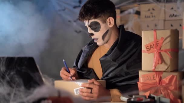 Arab Man Halloween Makeup Sits Home Decorated Office Communicates Client — 图库视频影像