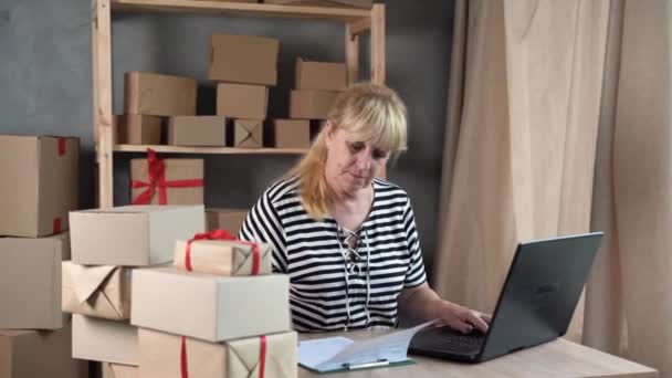 Older Female Entrepreneur Online Store Owner Using Laptop Work Preparing — Video