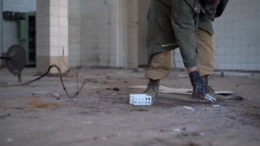 man walking in a ruined house or chemystry lab, horror, fear concept, radiation stalker in Chernobyl zombie apocalypse