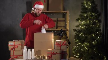 Donate and man in Santa Claus hat. Christmas donation, holiday charity concept