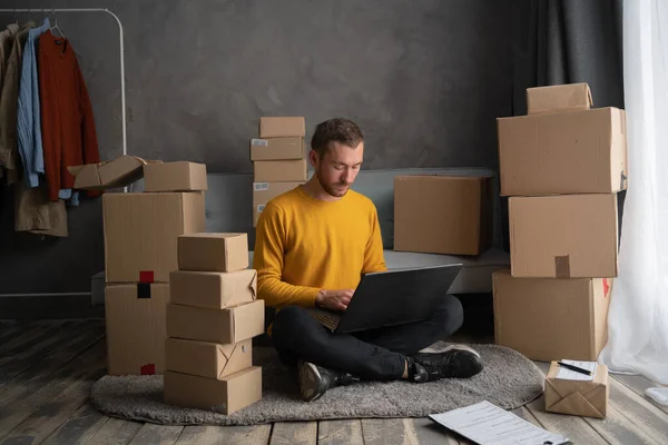 male online store small business owner entrepreneur packing package post shipping box preparing delivery parcel. men working laptop computer from home with postal parcel, Selling online ideas concept