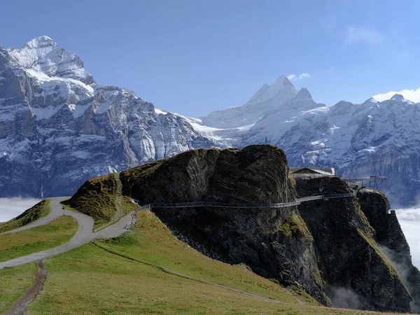 Gorgeous picturesque location, First named mountain station with Cliff Walk and Schreckhorn peak in background, Grindelwald, Bernese Oberland, Switzerland, Europe