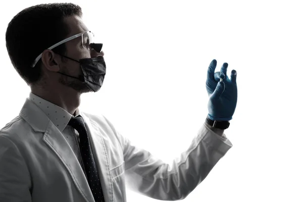 Silhouette Male Dentist Wearing Magnifying Binocular Holding Veneer Hands Isolated — Foto de Stock