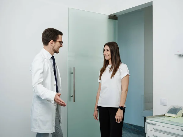 Side View Cheerful Male Dentist Medical Uniform Welcomes His Patient — Stock Photo, Image