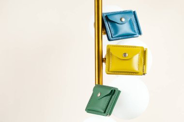 Three colorful leather wallets yellow and blue isolated on white background